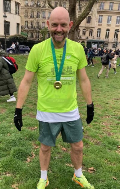 Finisher! Mike Sutliff ran the Paris marathon in under 3.5 hours after following Elite's guidance on his calf injury