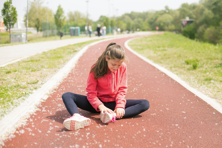 young runner with ankle injury